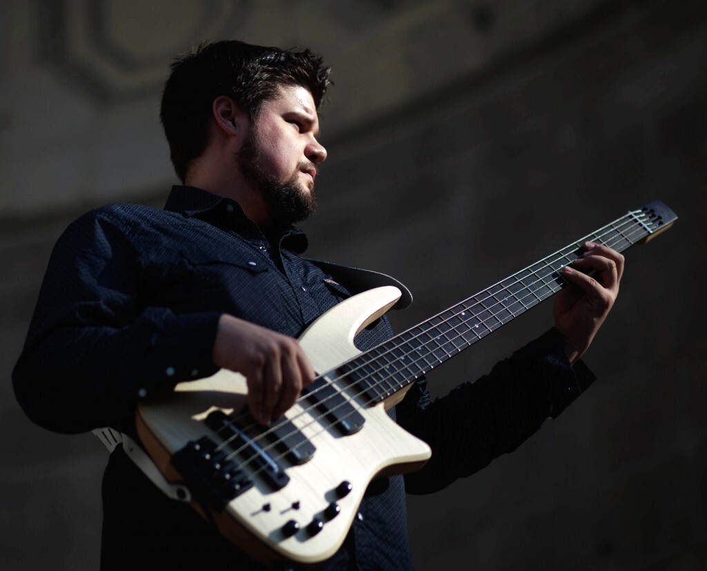 Photograph of NS Design Artist Marcos Varela playing his CR5 RADIUS Bass Guitar.