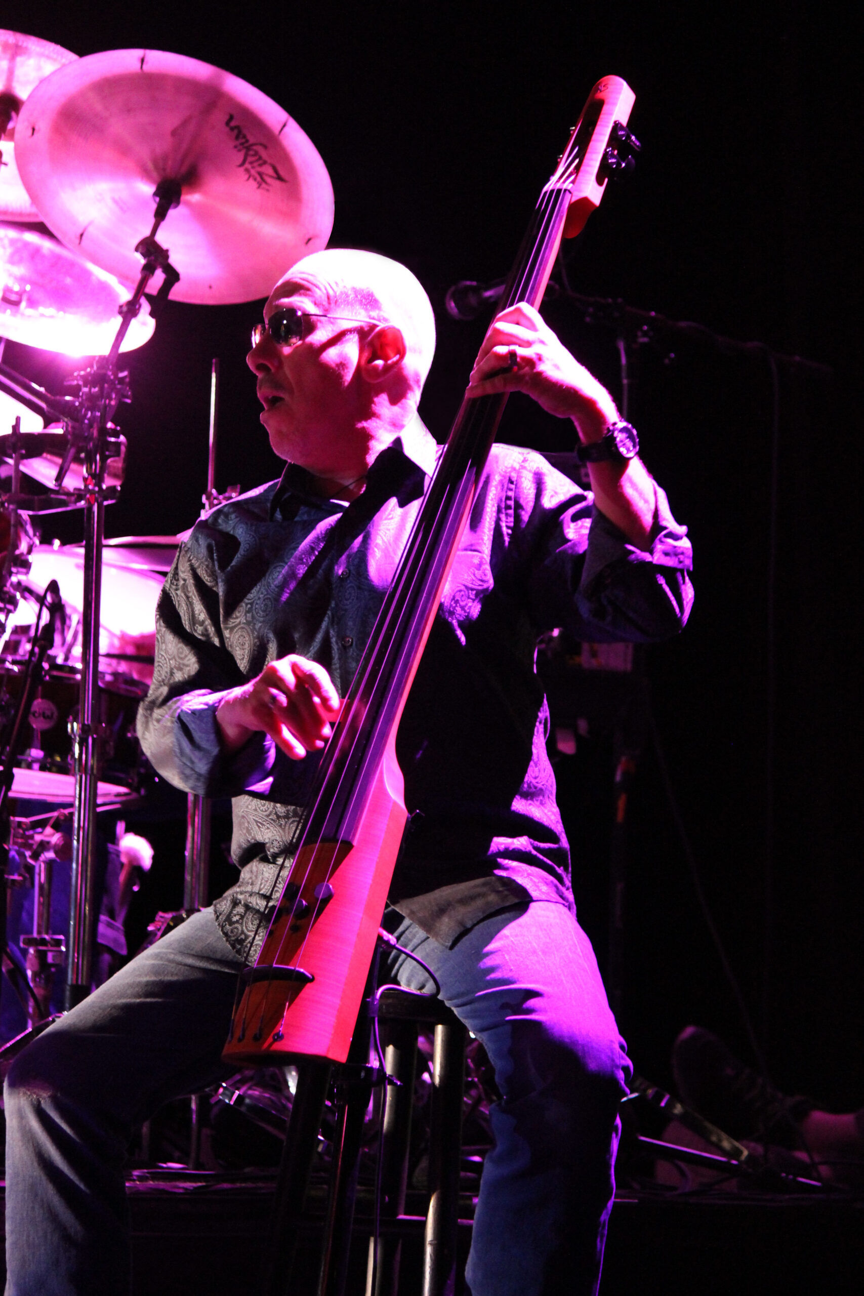 Photograph of NS Design Artist James "Hutch" Hutchinson playing his CR4M Electric Upright Bass on tour with Bonnie Raitt. Photo by Noor Che'ree of Cookie Monstah Photography.