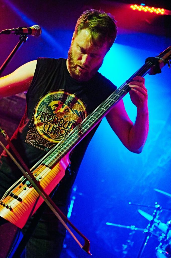 Photograph of NS Design Artist Eyvind W. Axelsen playing his CR4 Omni Bass in zebrawood finish. Photo by Maja Kasztelan.