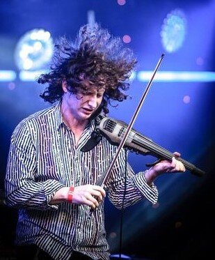Photograph of NS Design Artist Pascal Roggen playing his CR5 Electric Violin with Shez Raja Collective at London's Ilsington Hall.