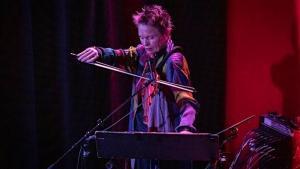 Phtotograph of NS Design Artist Laurie Anderson playing the NS CR Electric Violin at the SFJazz Concert Series