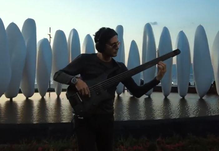 Photograph of NS Design Artist Selim Gürcan playing his CR5 RADIUS Bass Guitar in his video My Music Box.