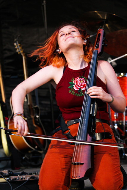Photograph of Katie Larson playing her NXT5a Electric Cello with The Accidentals, photo by Paul Jendrasiak.