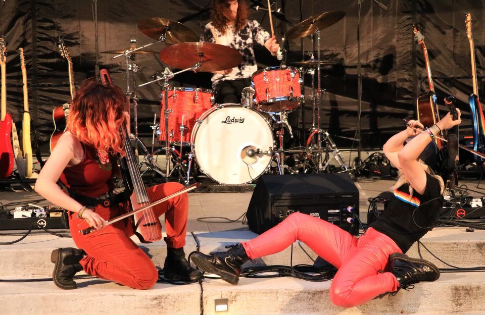 Photograph of Katie Larson playing her NXT5a Electric Cello with The Accidentals.